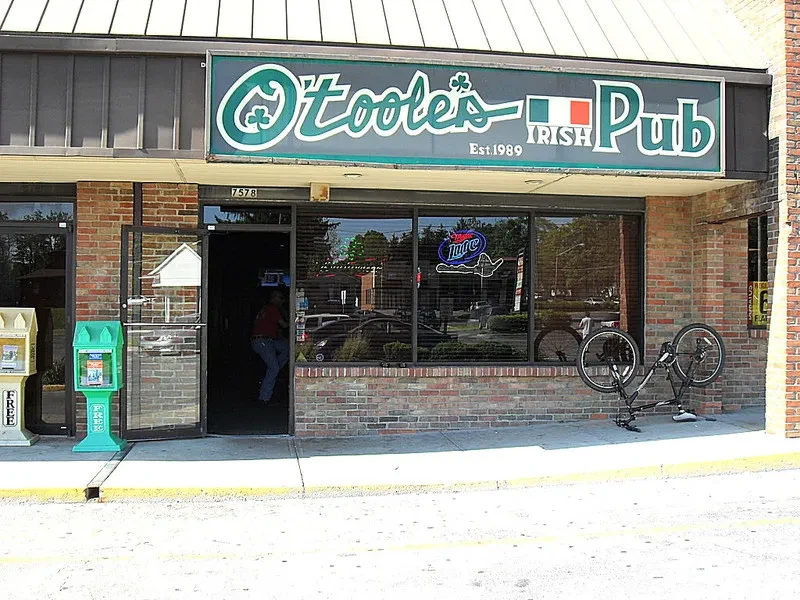 Exterior of O'Toole's Irish Pub with a person entering.