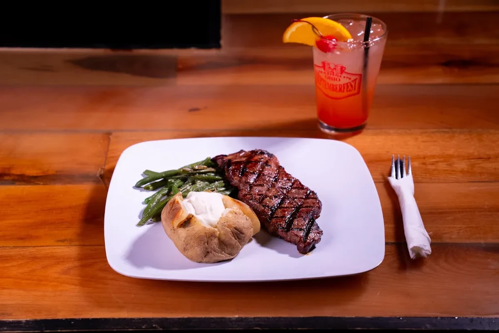 Grilled steak dinner with baked potato and Madison Septemberfest cocktail.