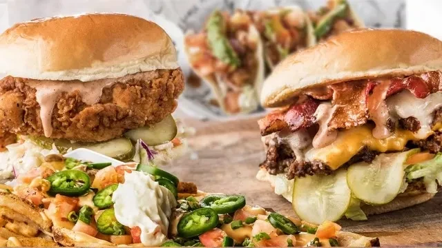Crispy chicken sandwich, beef burger with bacon, and loaded fries.