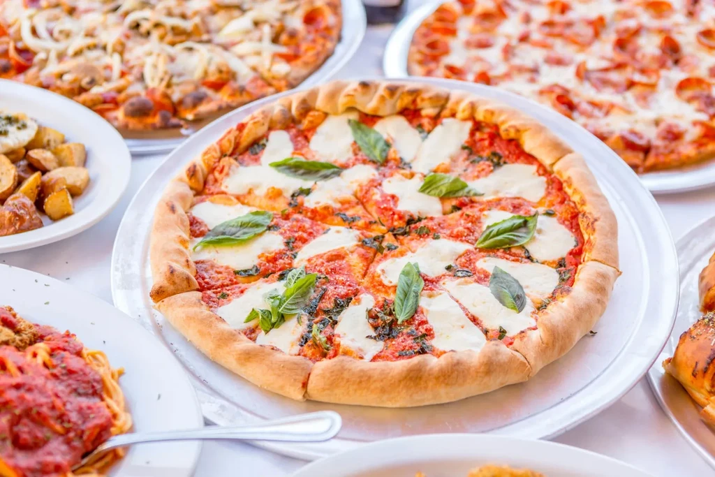 Neapolitan Margherita pizza featured among various Italian dishes.