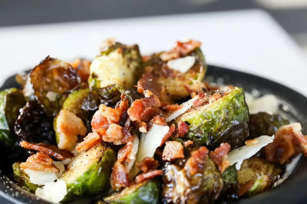Roasted Brussels sprouts, crispy bacon, and shaved Parmesan cheese.