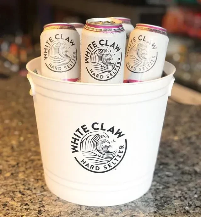 White Claw branded bucket filled with assorted White Claw seltzer cans.