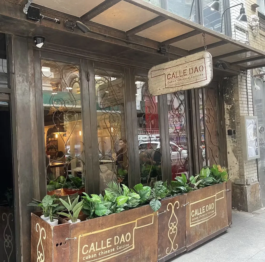 "Calle Dao: Cuban Chinese Cuisine" restaurant storefront with plant boxes.