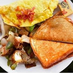 Breakfast plate with an omelet, potatoes, and a grilled cheese sandwich.