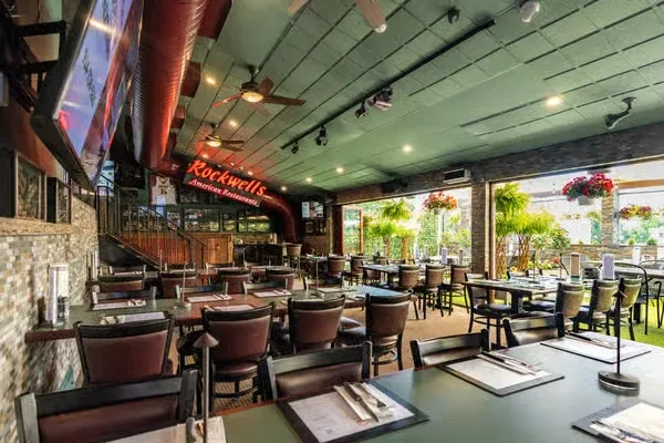 Empty Rockwells American Restaurant with indoor and outdoor seating.