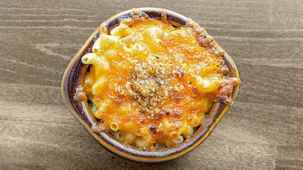 Baked mac and cheese in a bowl, with a breadcrumb topping.