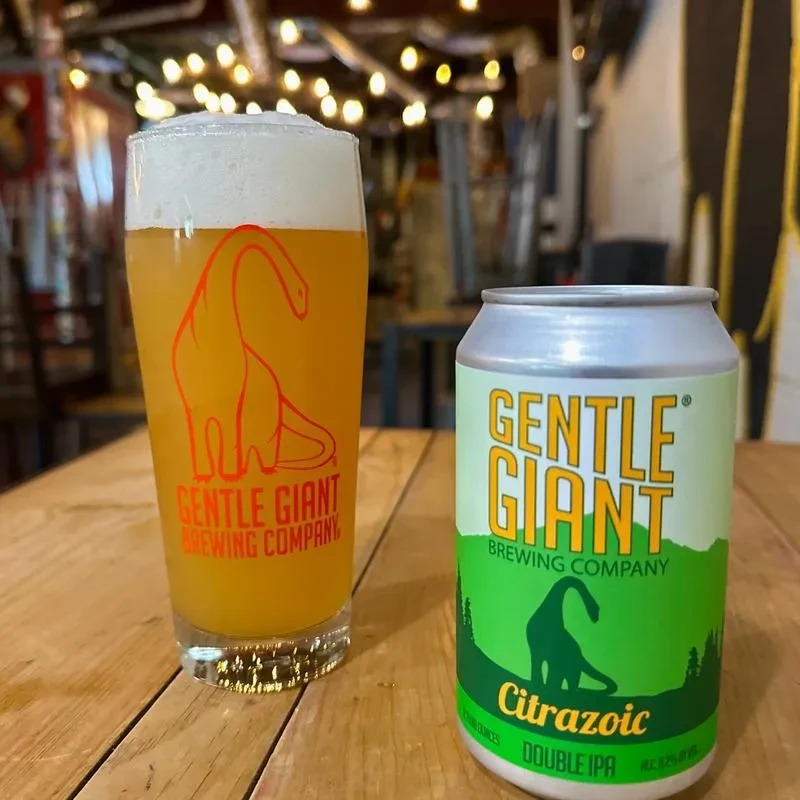 A glass of beer and a beer can from Gentle Giant Brewing Company.