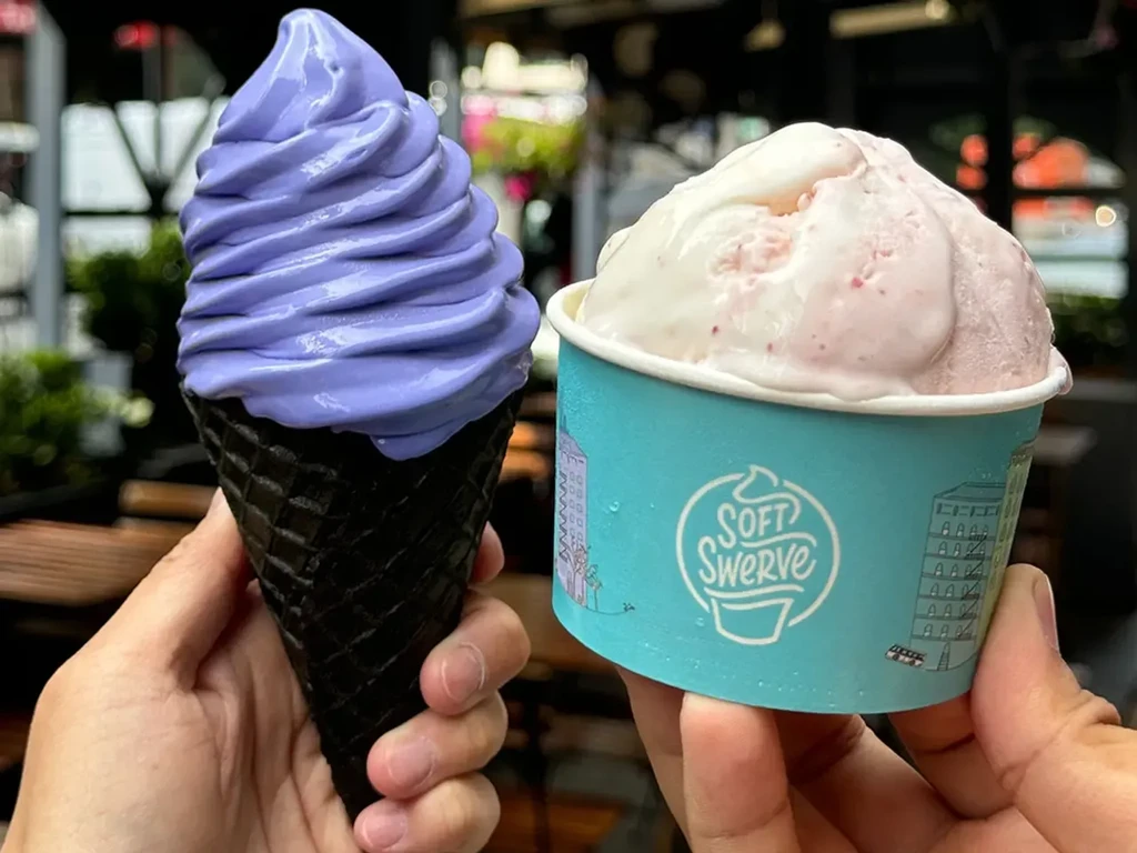 Purple soft-serve in black cone, ice cream in "Soft Swerve" cup.