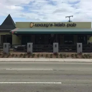 Crazy's Irish Pub exterior with unique conical roof and patio.