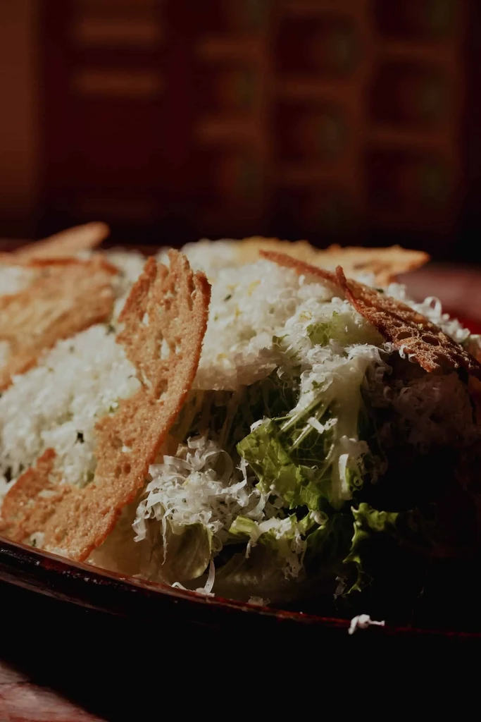 Crisp Caesar salad topped with abundant Parmesan and golden croutons.