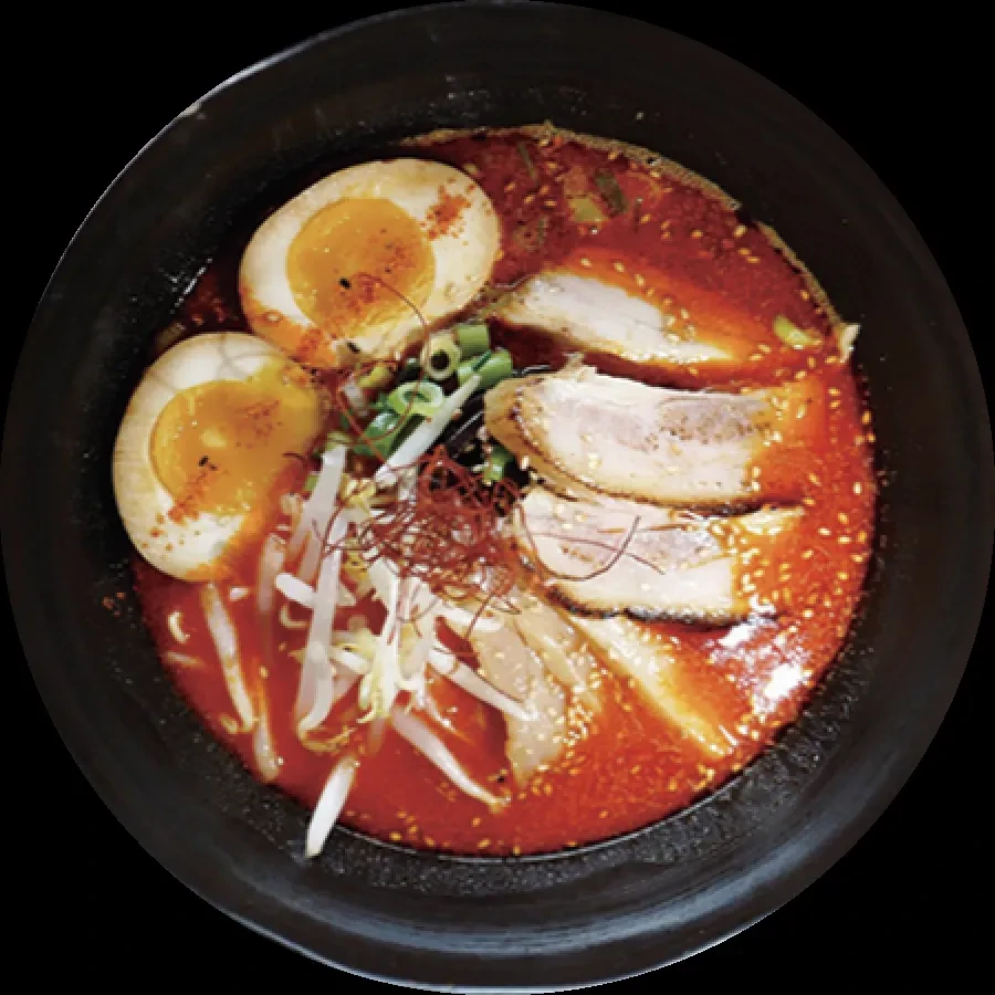 Top-down ramen with pork, egg, bean sprouts, scallions, chili threads.