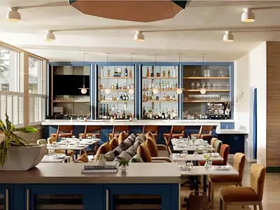 Modern restaurant interior with well-lit bar and dining area.