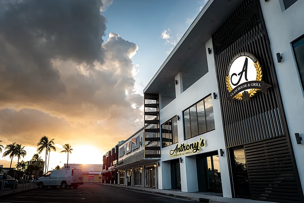 Anthony's Clam House & Grill building illuminated by sunset.