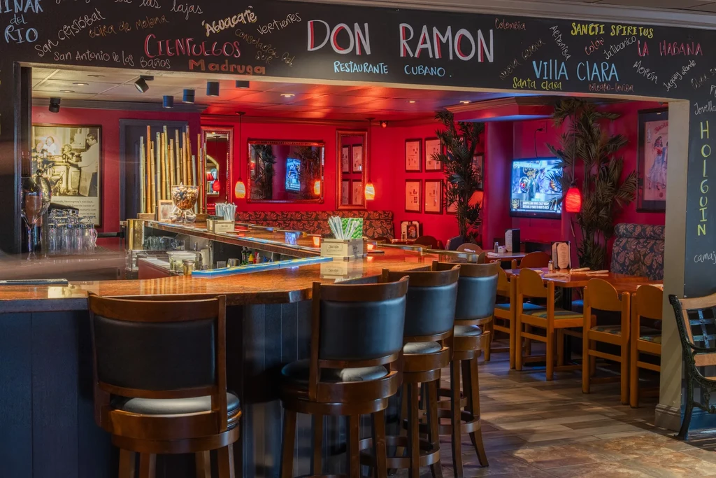 Don Ramon Restaurante Cubano's empty bar area with red walls and decor.