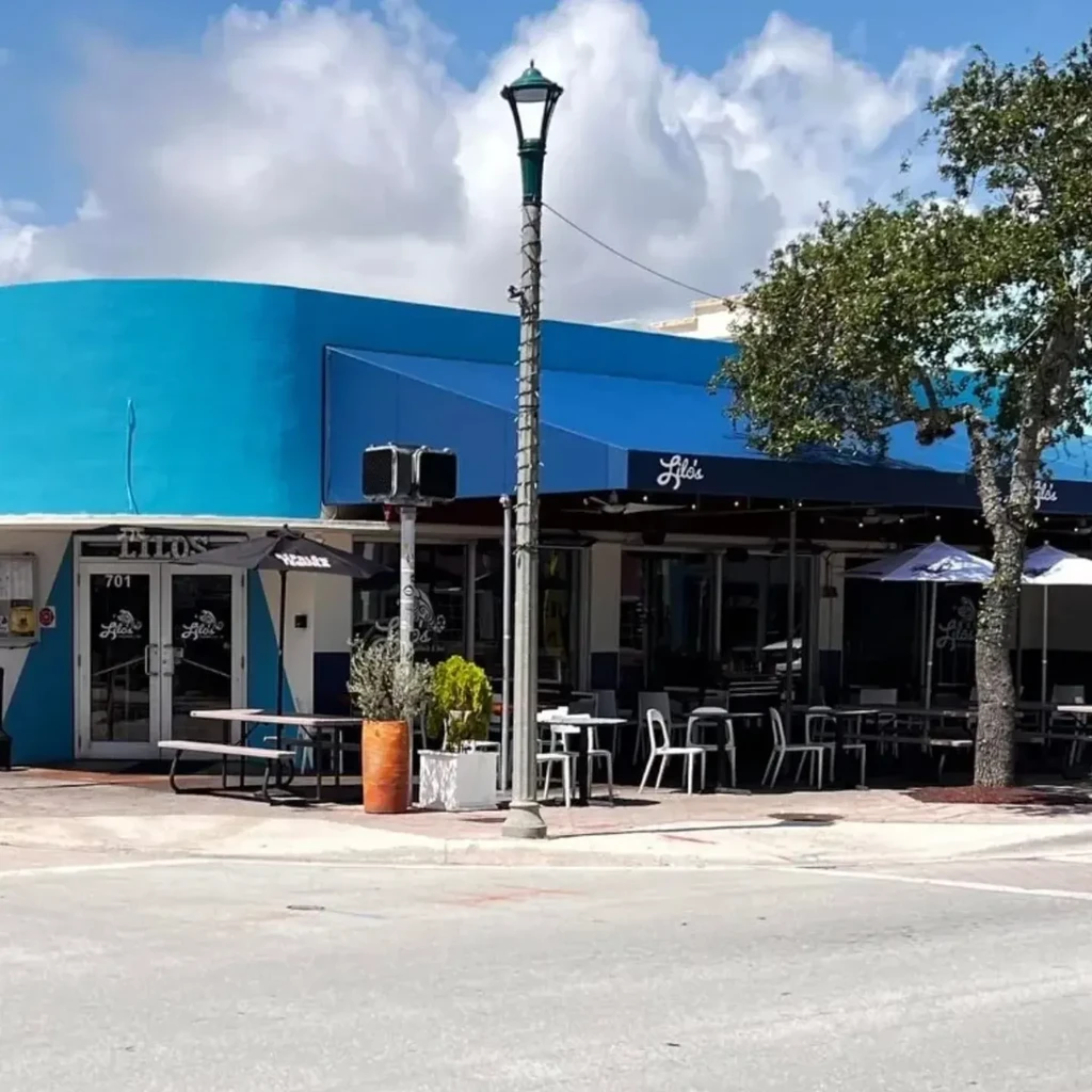 Lilo's restaurant exterior with curved blue facade and sidewalk seating.
