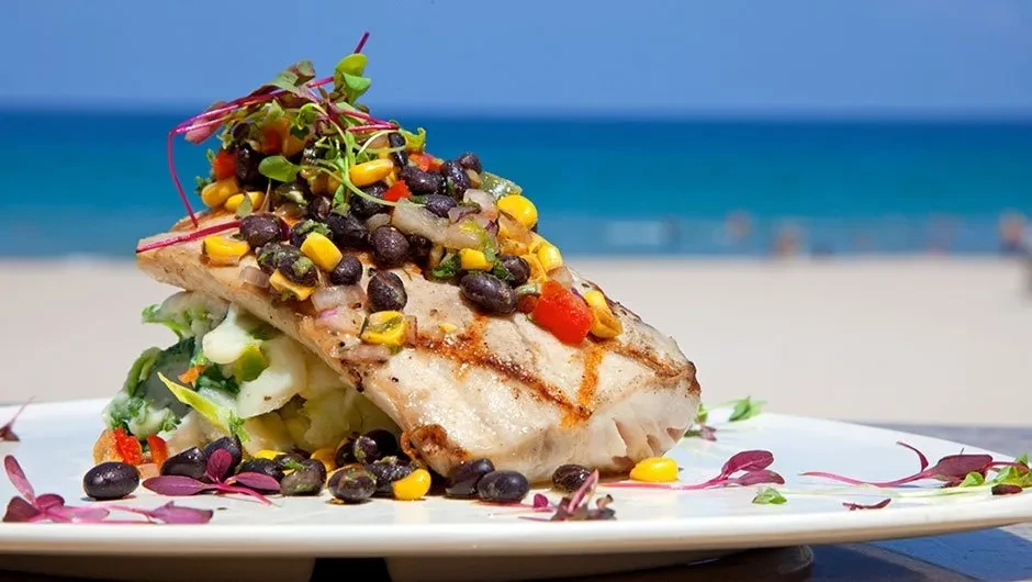 Grilled fish, bean and corn salsa, mashed potatoes, microgreens, ocean view.