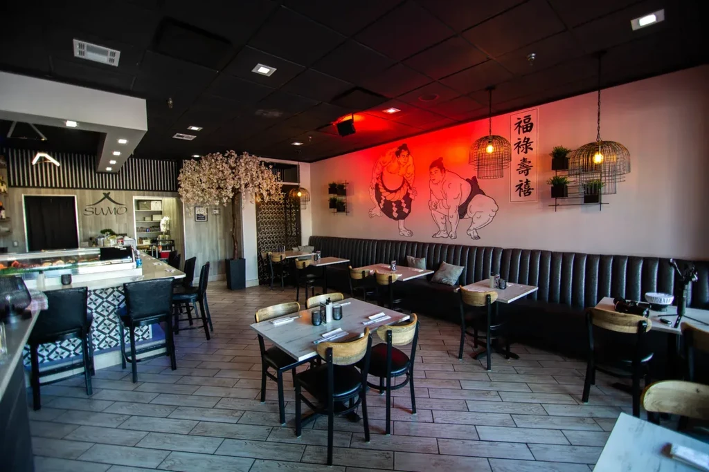 Modern Japanese Sumo-themed restaurant with sushi bar and dining area.