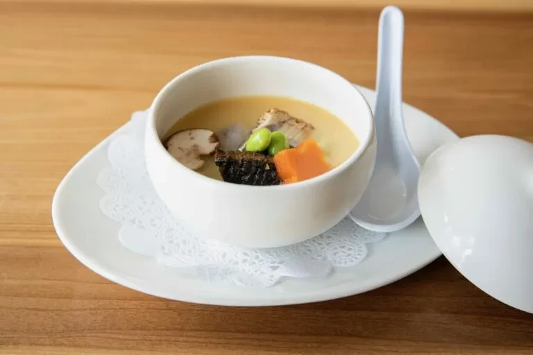Japanese chawanmushi with shiitake mushrooms, fish, carrots, and edamame.