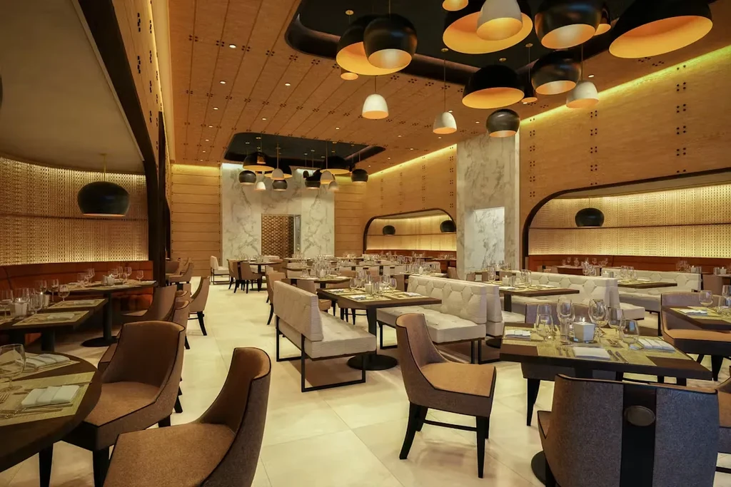 Modern restaurant dining area, empty, featuring elegant tables and unique lighting.