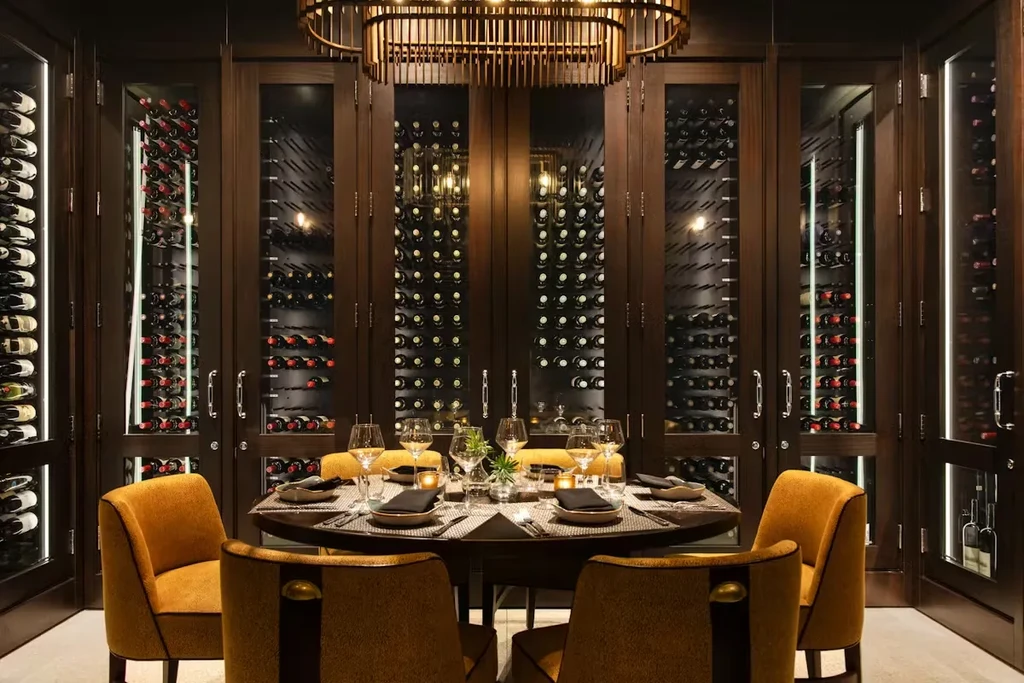 Elegant wine cellar private dining room, table set for six.