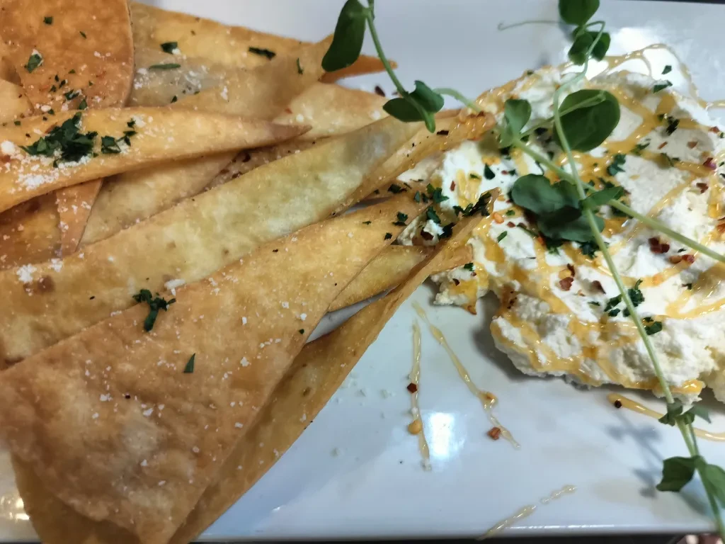 Fried pita chips with creamy ricotta dip, honey, and chili flakes.