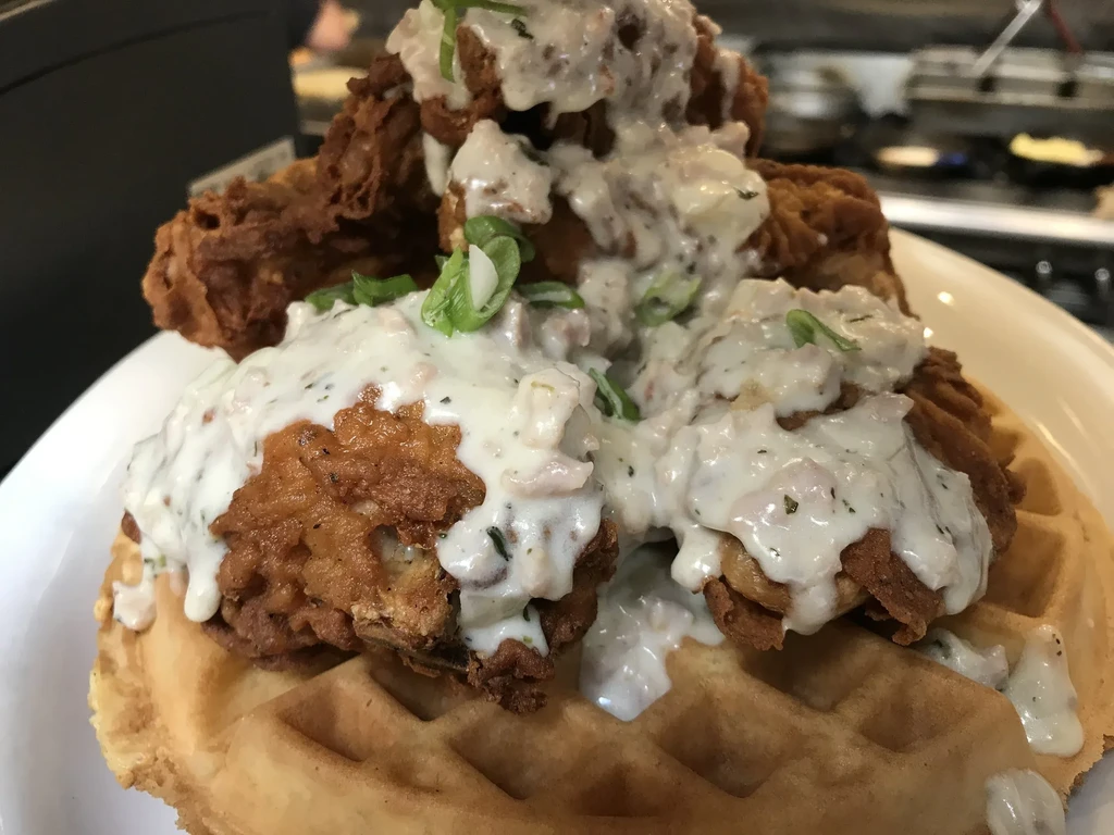 Fried chicken and gravy on a waffle.
