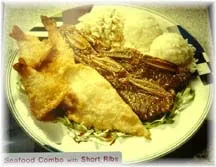 Fried seafood and short ribs with rice and macaroni salad.