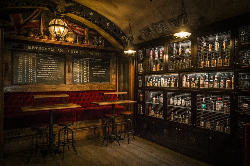 A bar resembling a vintage Metropolitan District Railway car interior.