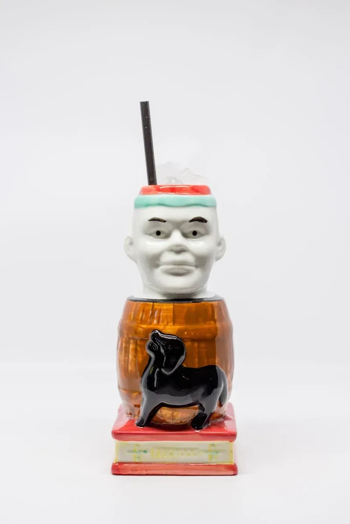 Vintage "Paddy the Pig" ceramic cocktail tiki mug with a straw.