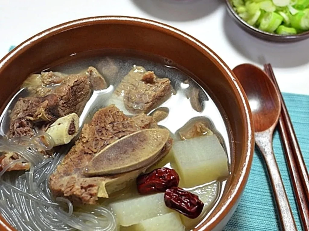 Galbi-tang, Korean beef short rib soup, with noodles, radish, and jujubes.