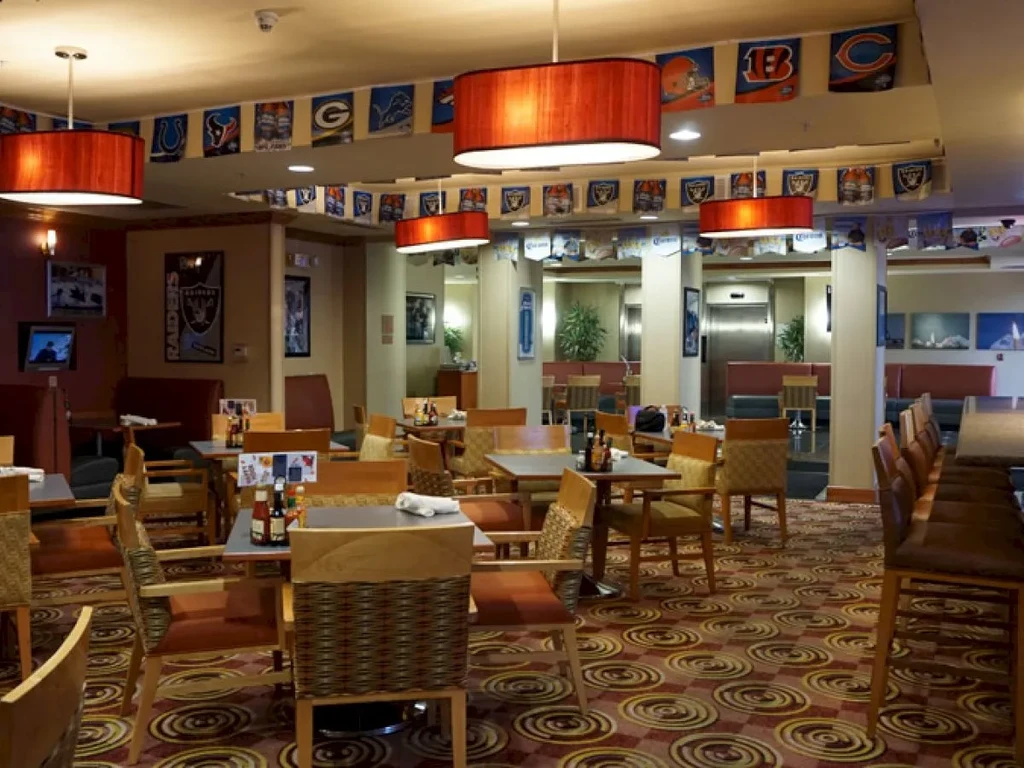 A restaurant or bar decorated with NFL team banners.