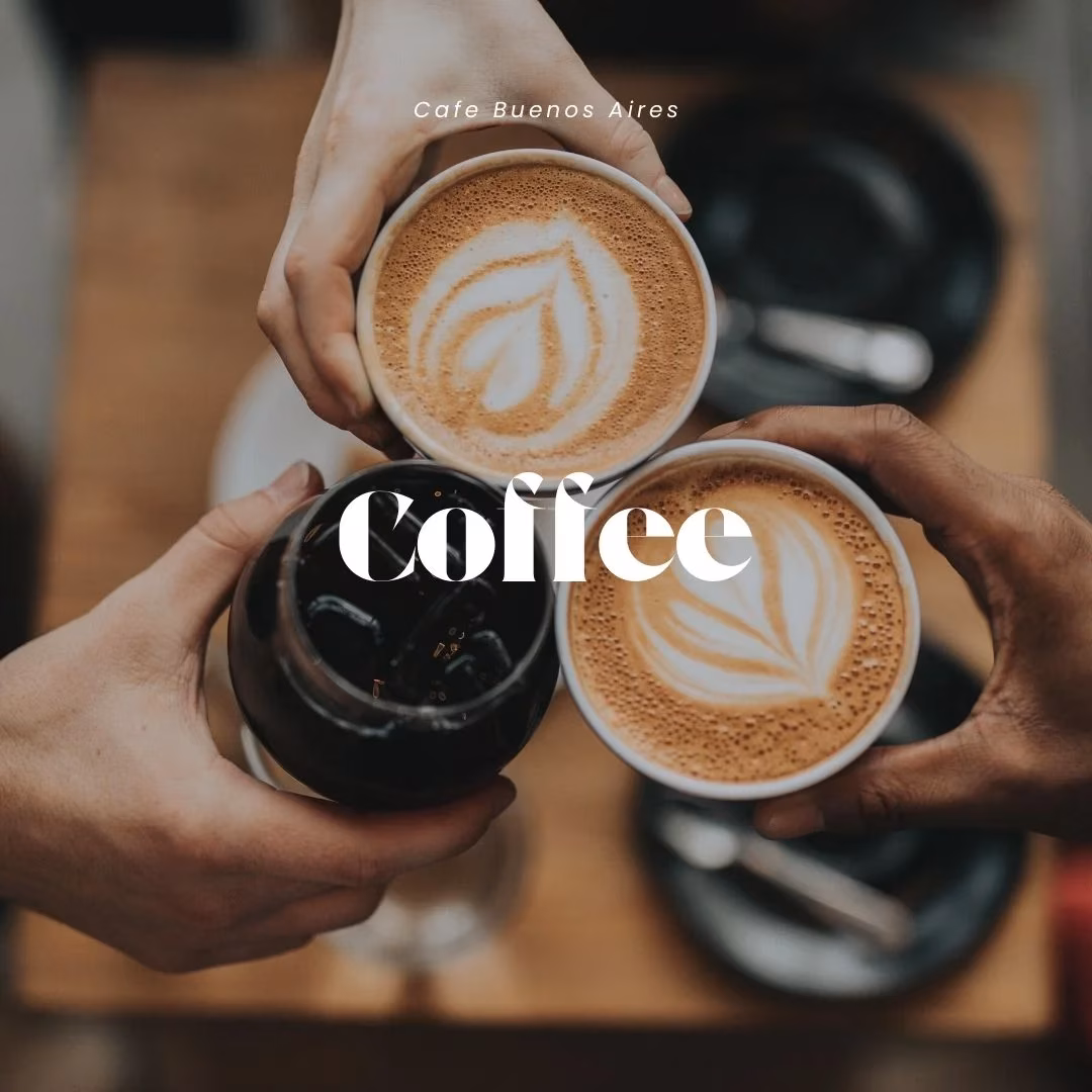 Three hands holding various coffee drinks, two with latte art.