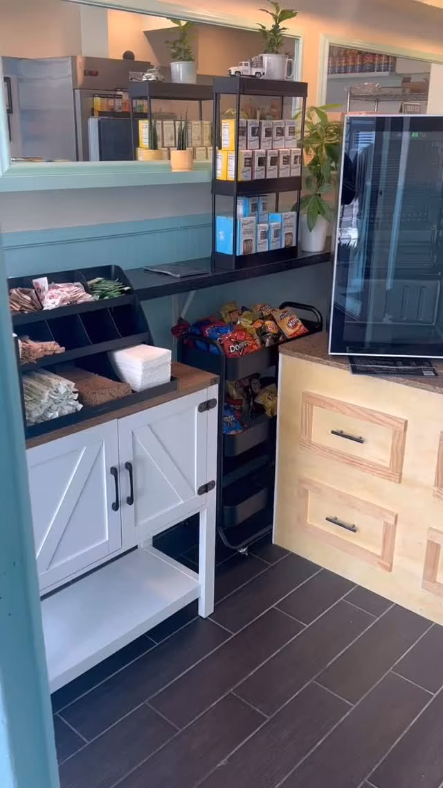 Self-service station with packaged snacks, napkins, and chip bags.
