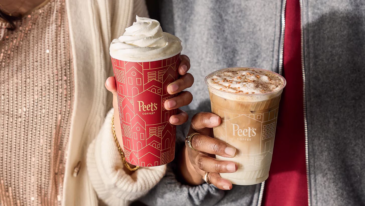 Two people hold Peet's hot and iced seasonal coffee drinks.