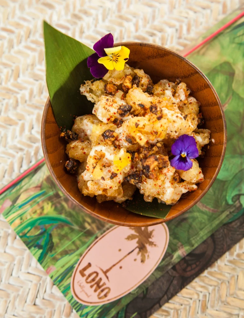 Elaborate fried dish with flowers in wooden bowl; LONO Hollywood.