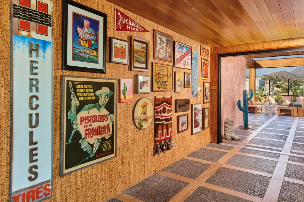 Hallway decorated with Western memorabilia, leading to an outdoor patio.