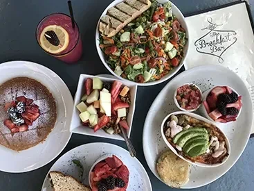 Overhead view of a colorful breakfast and brunch spread.