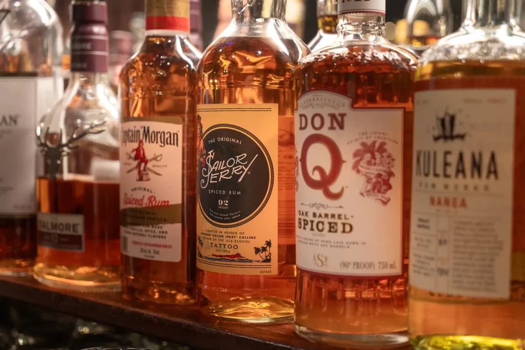 Close-up of Captain Morgan, Sailor Jerry, Don Q rum bottles.