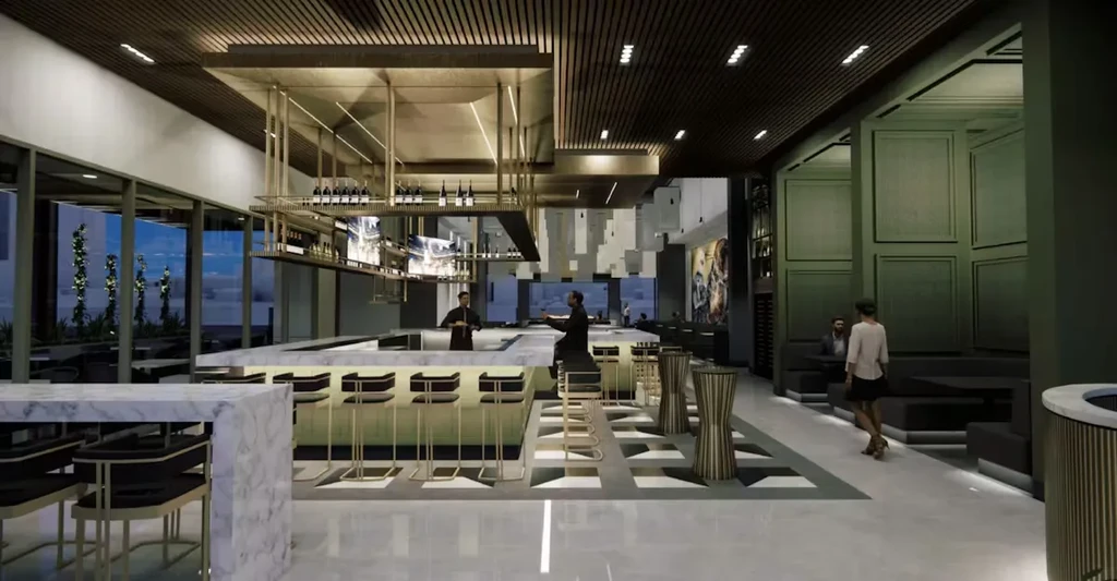 Modern bar and restaurant interior with white marble counter and gold accents.