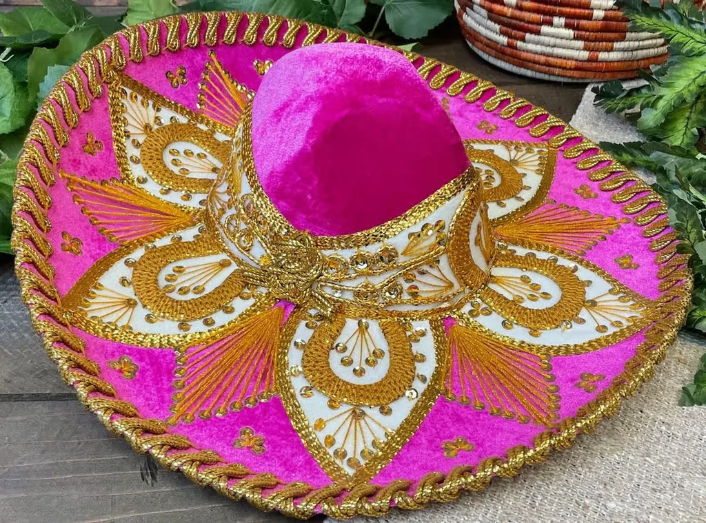 Vibrant fuchsia velvet sombrero with intricate gold embroidery and sequins.