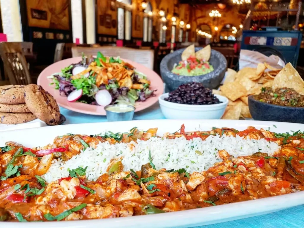 A vibrant spread of Mexican-inspired cuisine in an upscale restaurant setting.