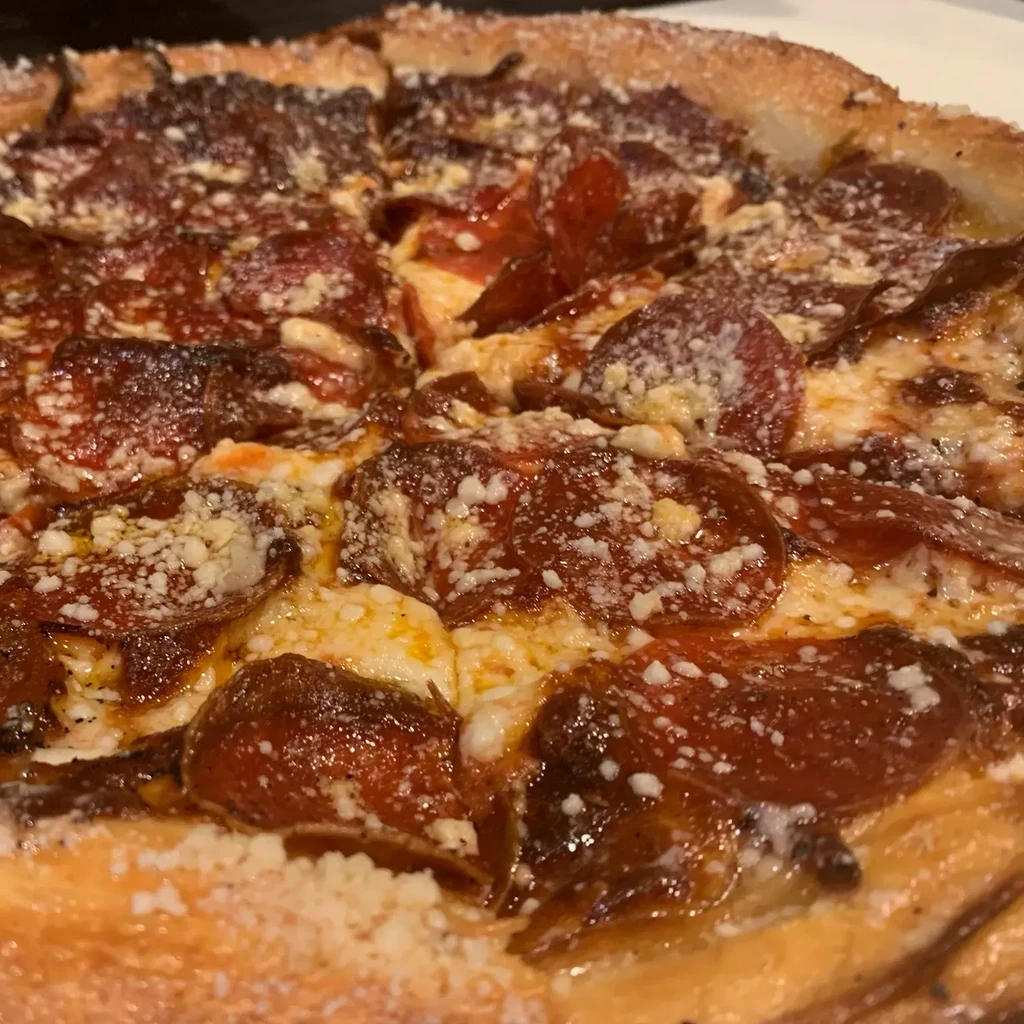 Close-up, high-angle view of a freshly baked pepperoni pizza.