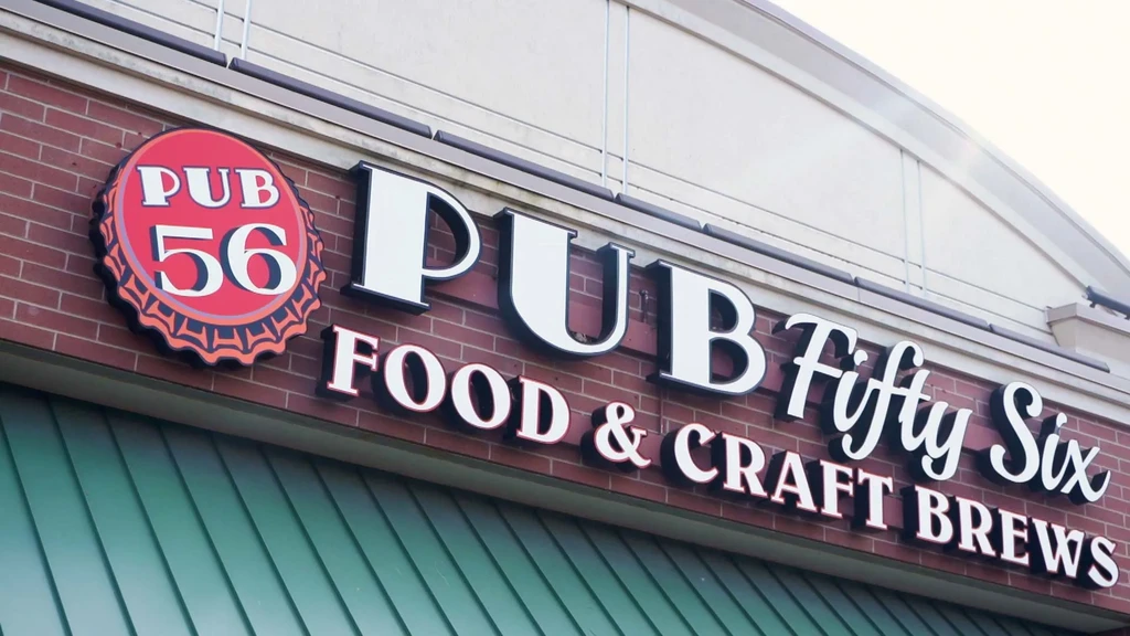 PUB Fifty Six restaurant sign, featuring food and craft brews.