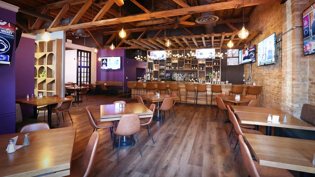 Interior of a modern restaurant and bar with industrial design.