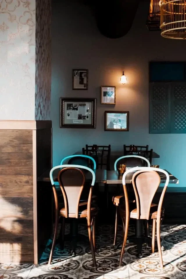 Interior view of a restaurant dining area with tables and chairs.
