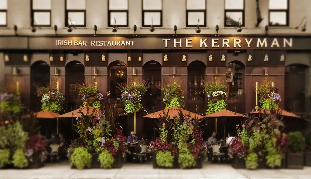 Exterior of The Kerryman Irish Bar and Restaurant with outdoor seating.