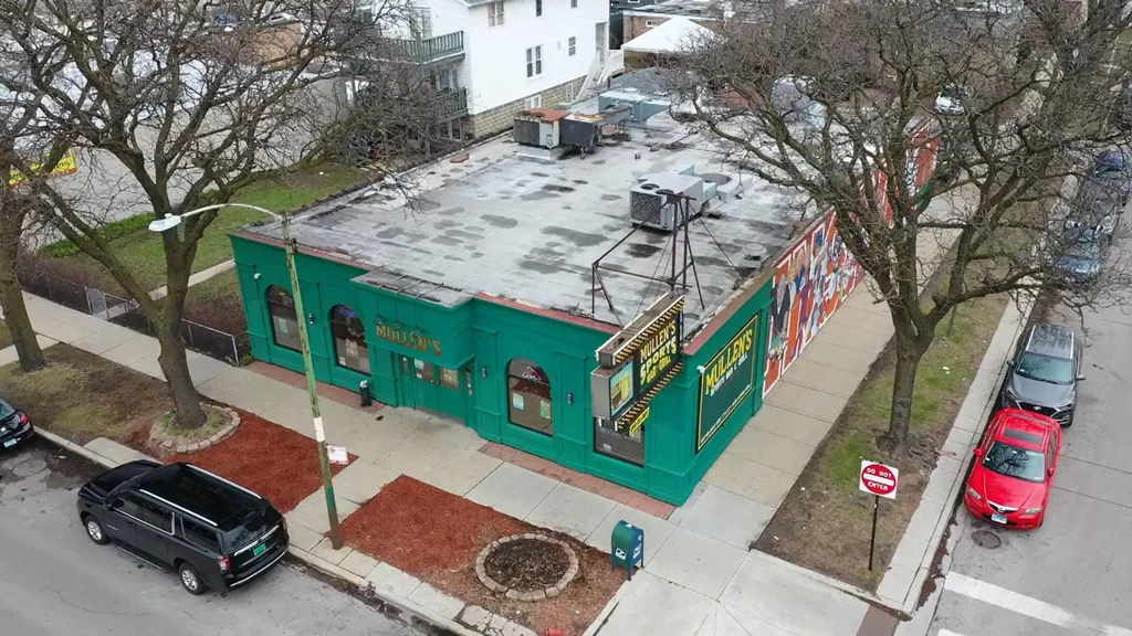 Aerial view of Mullen's Sports Bar & Grill with surrounding street.