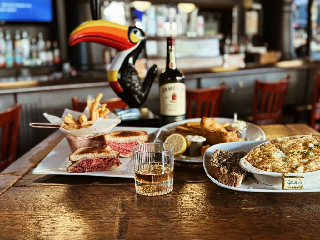 Table of corned beef, fish and chips, and macaroni and cheese.