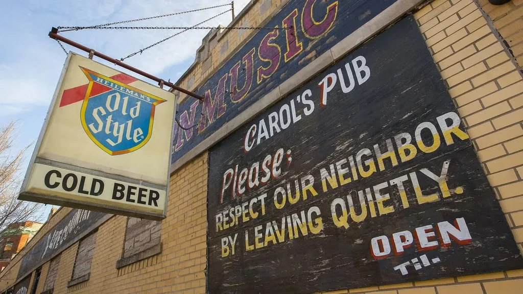 Exterior of Carol's Pub with signage for beer and live music.