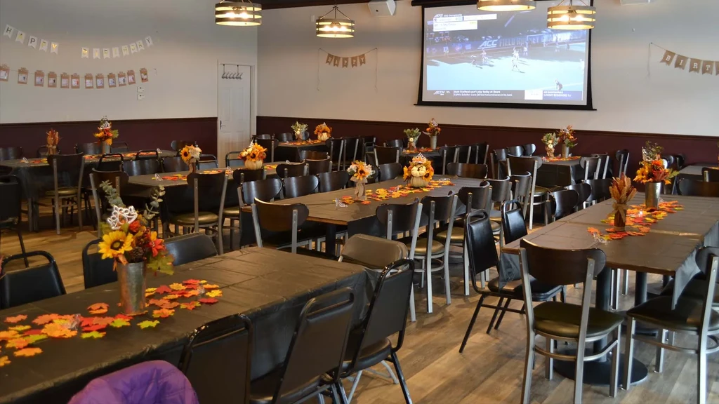 Empty restaurant dining area decorated for a fall birthday, field hockey playing.